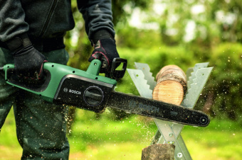 Электрическая цепная пила Bosch UniversalChain 40 1800Вт дл.шины:16" (40cm) (06008B8400) от магазина РЭССИ